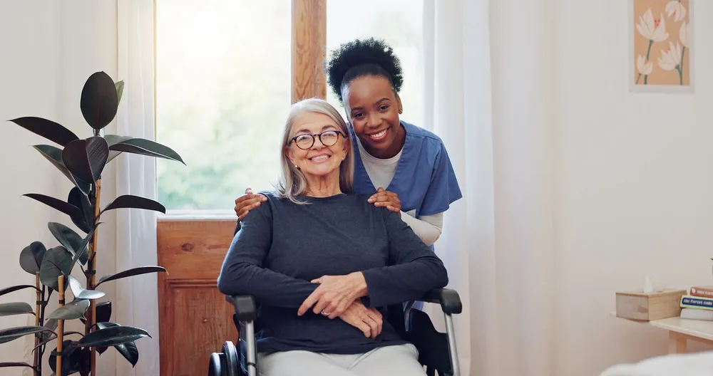 Support worker with a participant at home in a shared living environment