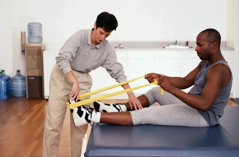 Support worker guiding a participant through a life skills exercise